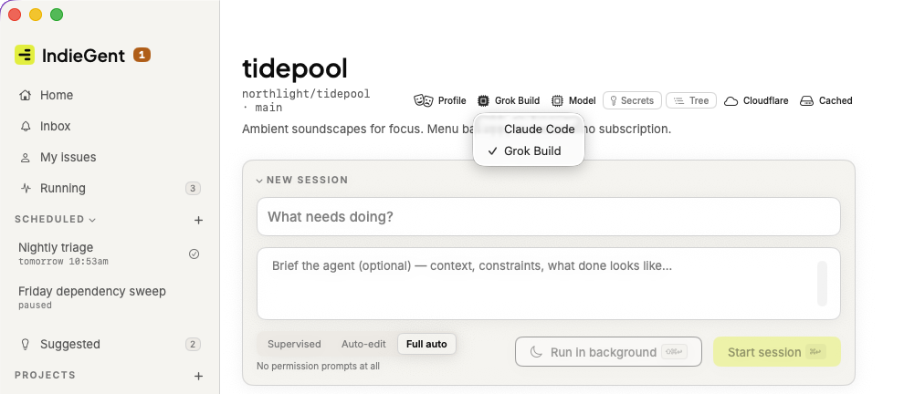 A project open in IndieGent with the provider chip's menu showing Claude Code and Grok Build, Grok Build ticked.